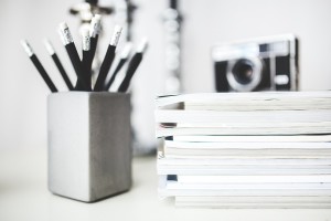 Career ideas. Camera sitting on a pile of books.