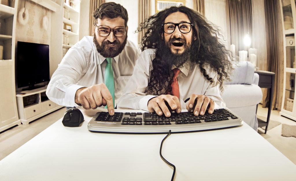 Two IT specialists working with a computer