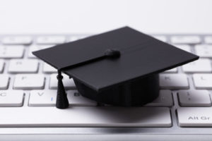 graduate hat on keyboard