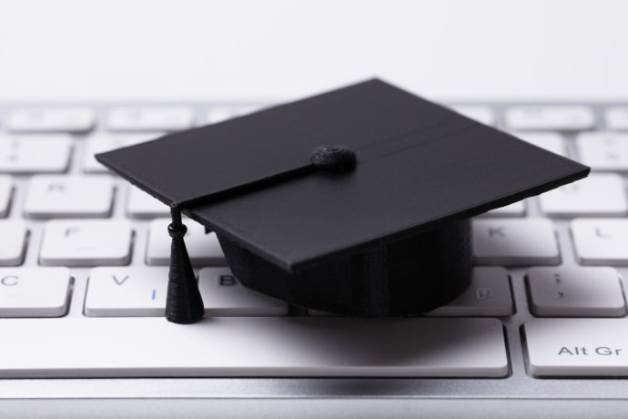 graduate hat on keyboard